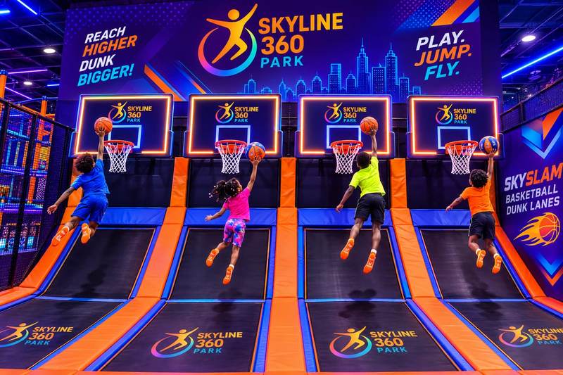 Jumpers slam dunking on the SkySlam dunk lanes